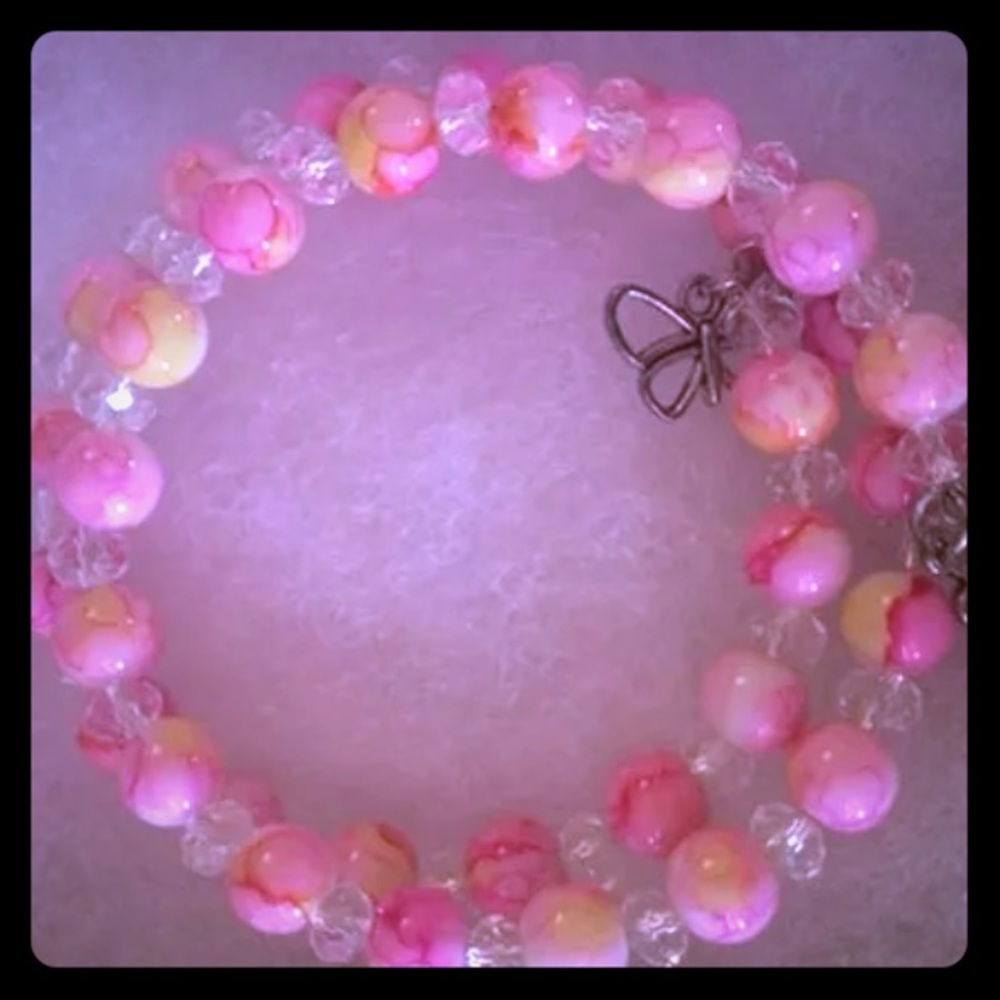 Beaded bracelet with butterfly charm